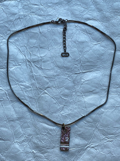 CHRISTIAN DIOR 1990's TROTTER PENDANT NECKLACE.