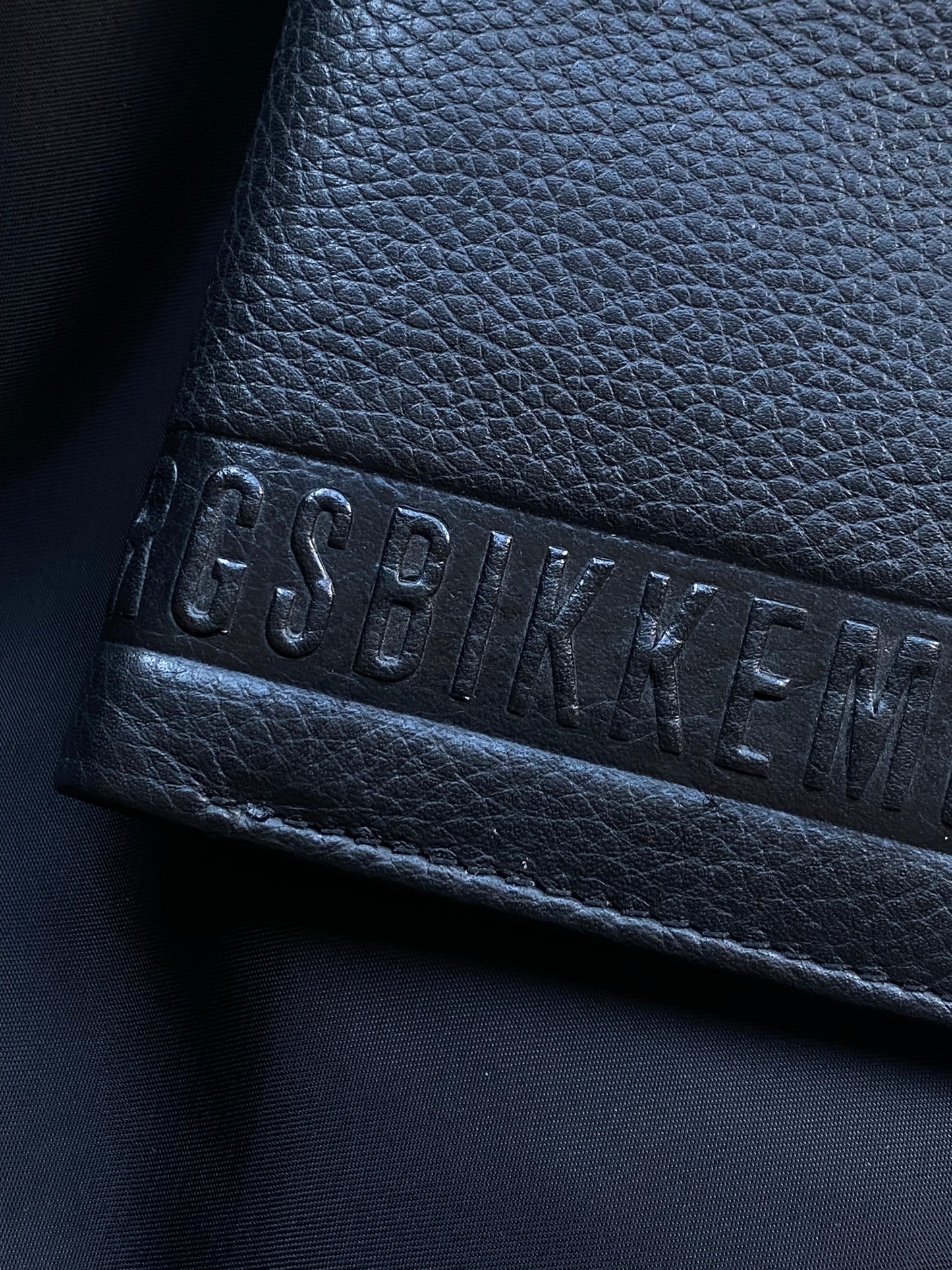 DIRK BIKKEMBERGS EMBOSSED LOGO LEATHER WALLET.