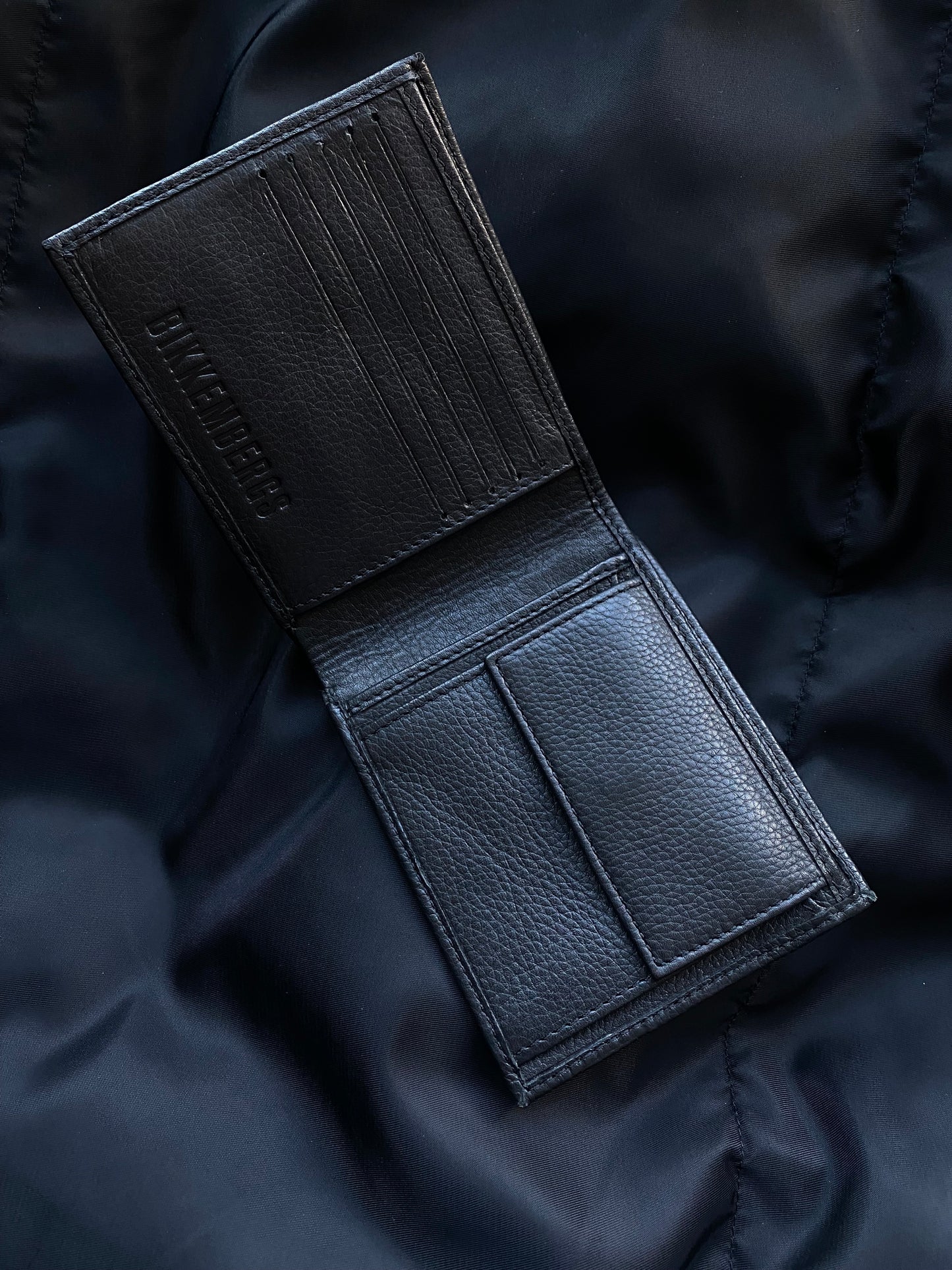 DIRK BIKKEMBERGS EMBOSSED LOGO LEATHER WALLET.