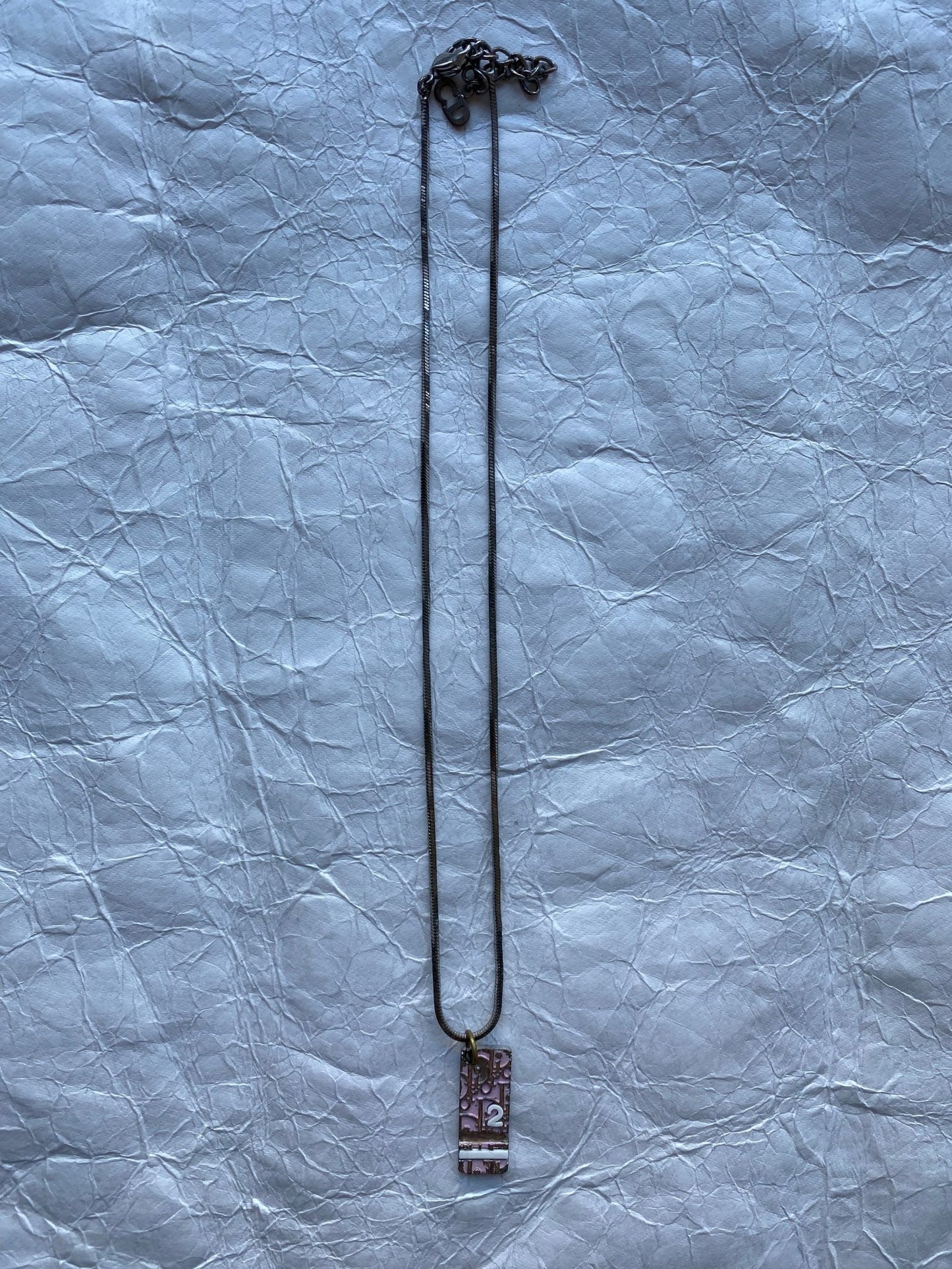 CHRISTIAN DIOR 1990's TROTTER PENDANT NECKLACE. - SEVENUES.