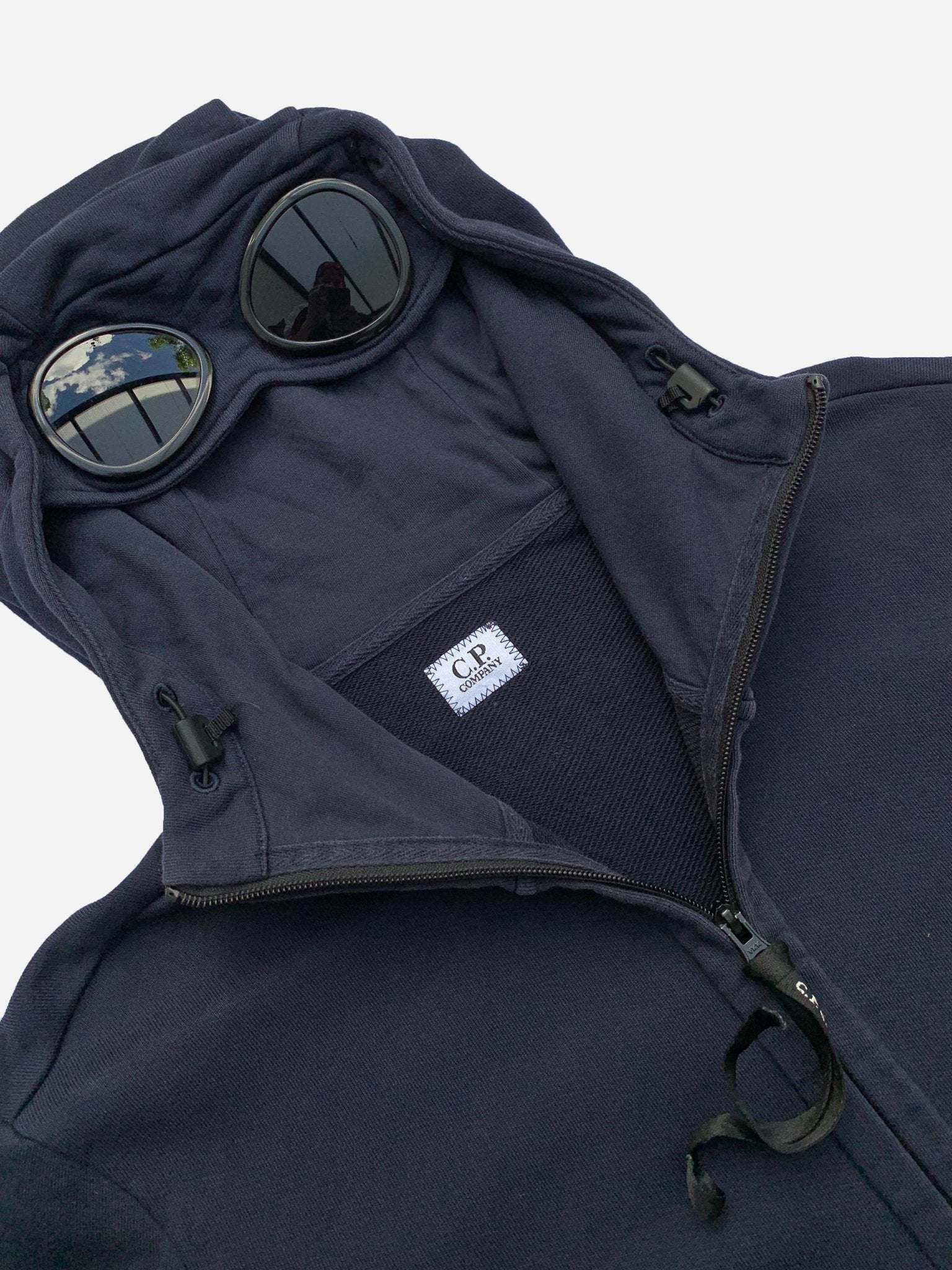 cp company goggle zip hoodie C.P. COMPANY ZIP-UP GOGGLE HOODIE. (L) – SEVENUES
