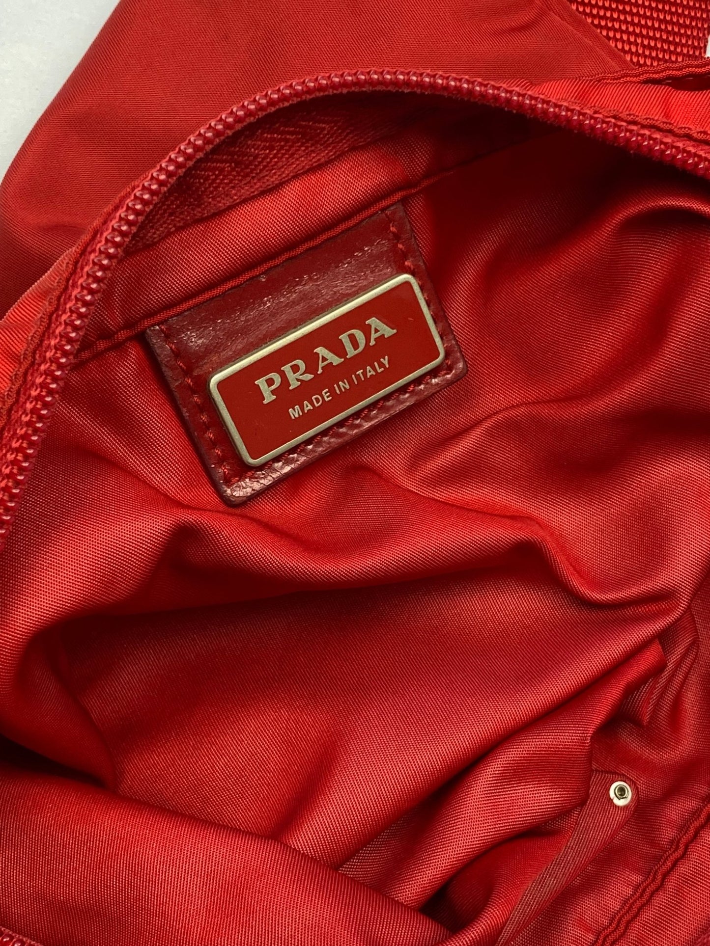 PRADA MILANO RED NYLON 'VELA' SLINGBAG. - SEVENUES.