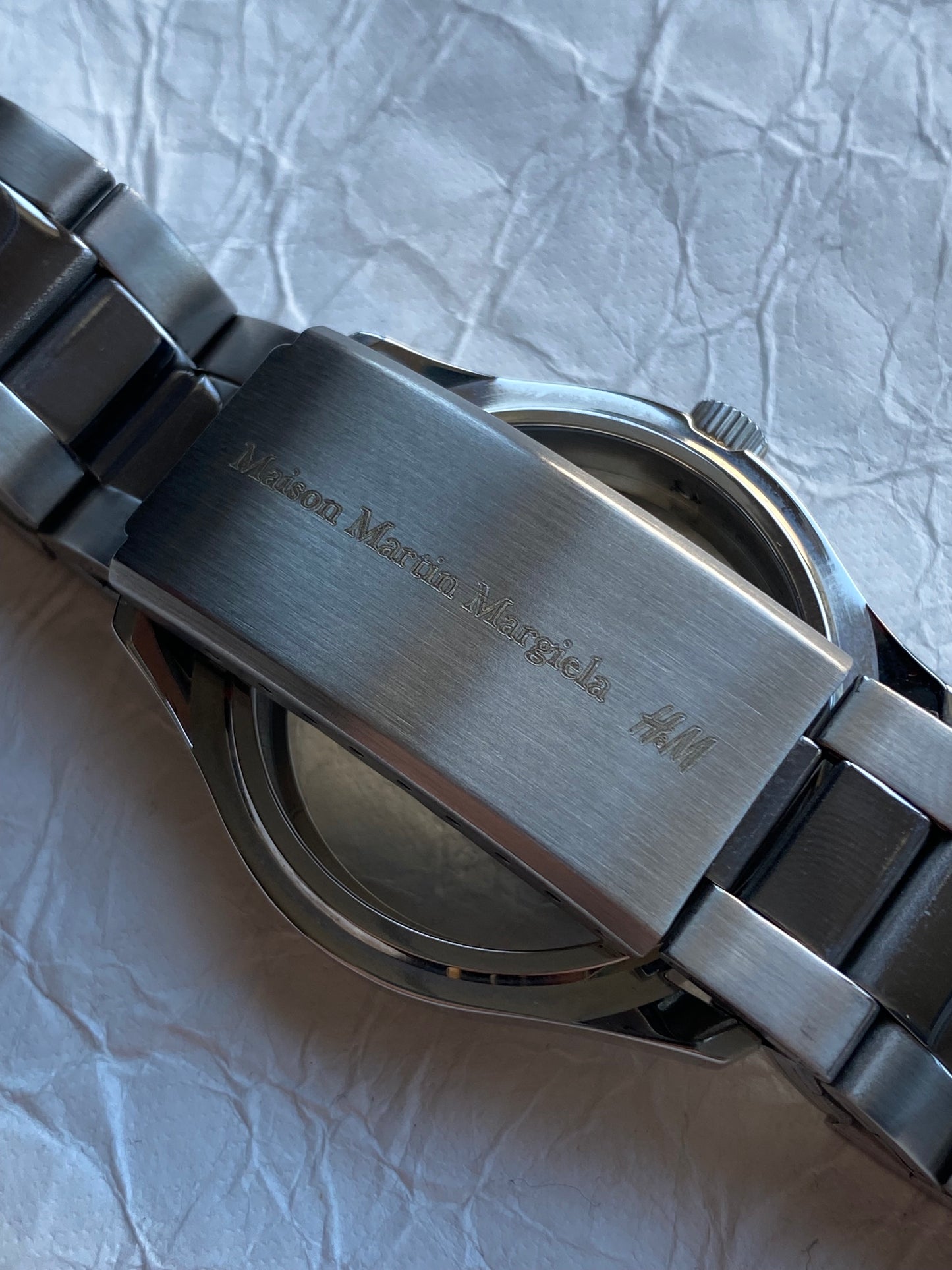 MAISON MARTIN MARGIELA X H&M RE-EDITION FACELESS WATCH BRACELET.