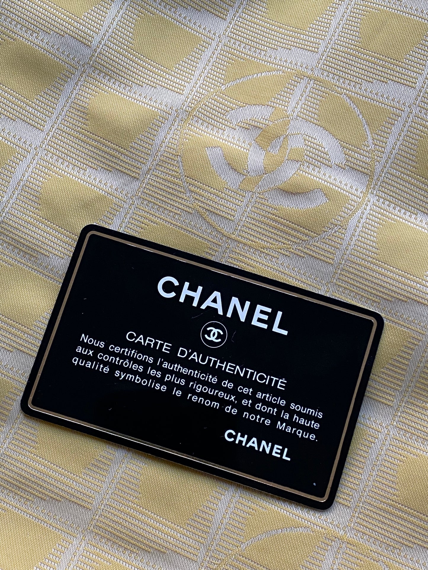 CHANEL TRAVEL LINE 'CC' MONOGRAM NYLON HAND BAG.